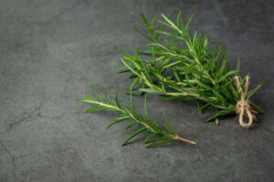 Dried rosemary in a small bowl – fragrant culinary herb with health benefits